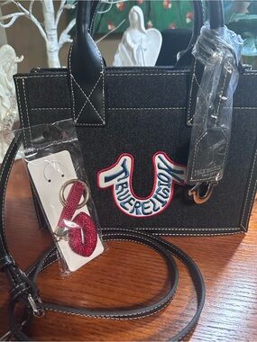 True Religion Black Denim Satchel with Red & Blue Logo Accent. Crossbody strap